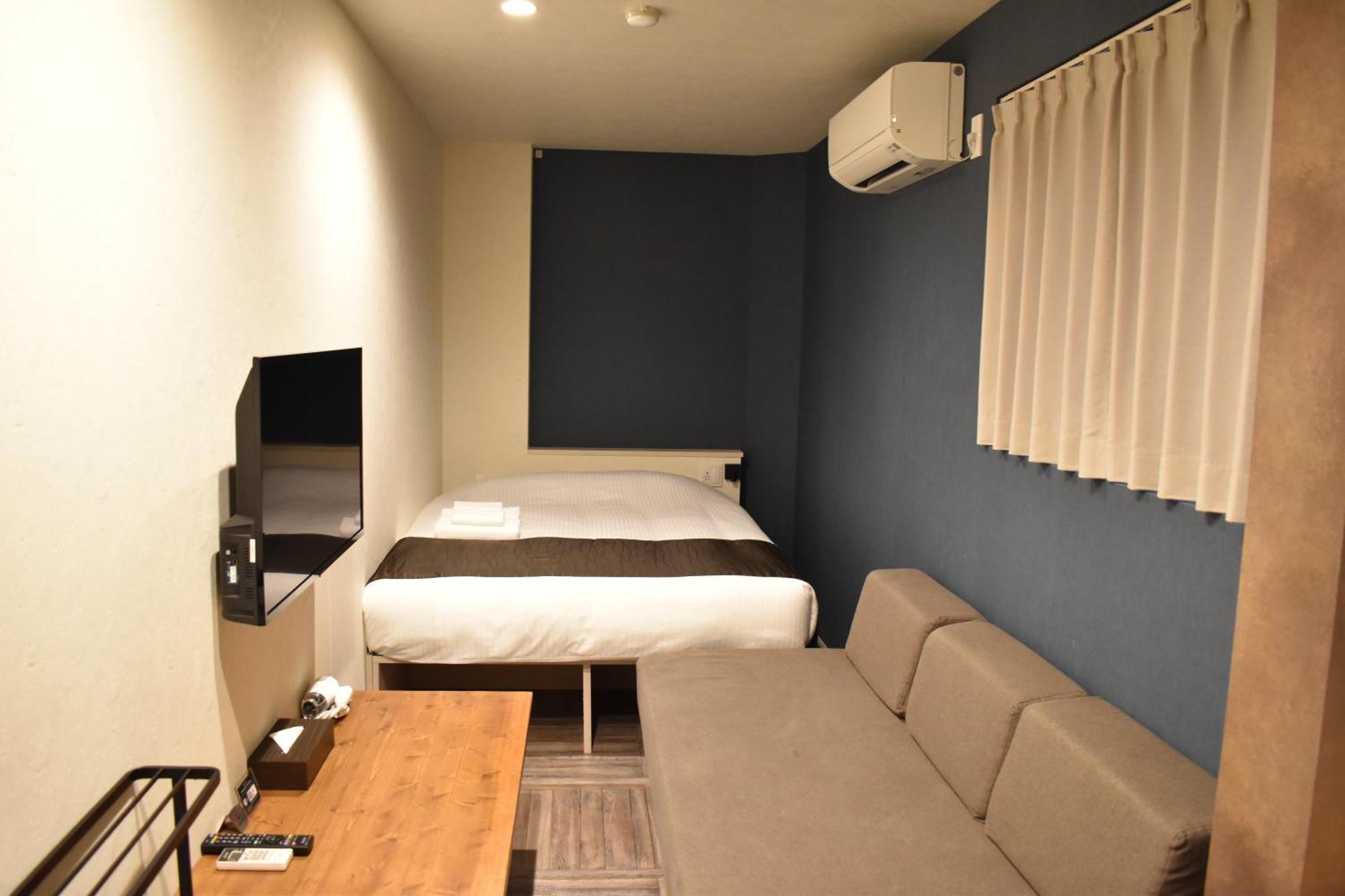 Shinsaibashi House Hotel Osaka Phòng bức ảnh